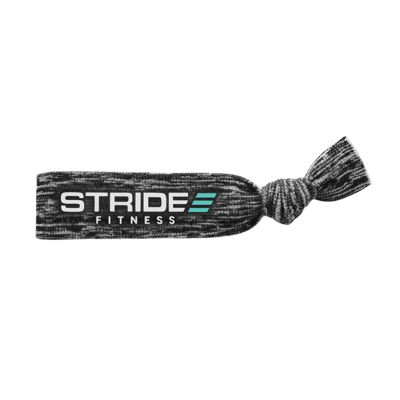 Grey STRIDE Fitness knotted hair tie designed for secure hold during workouts, running, and everyday wear
